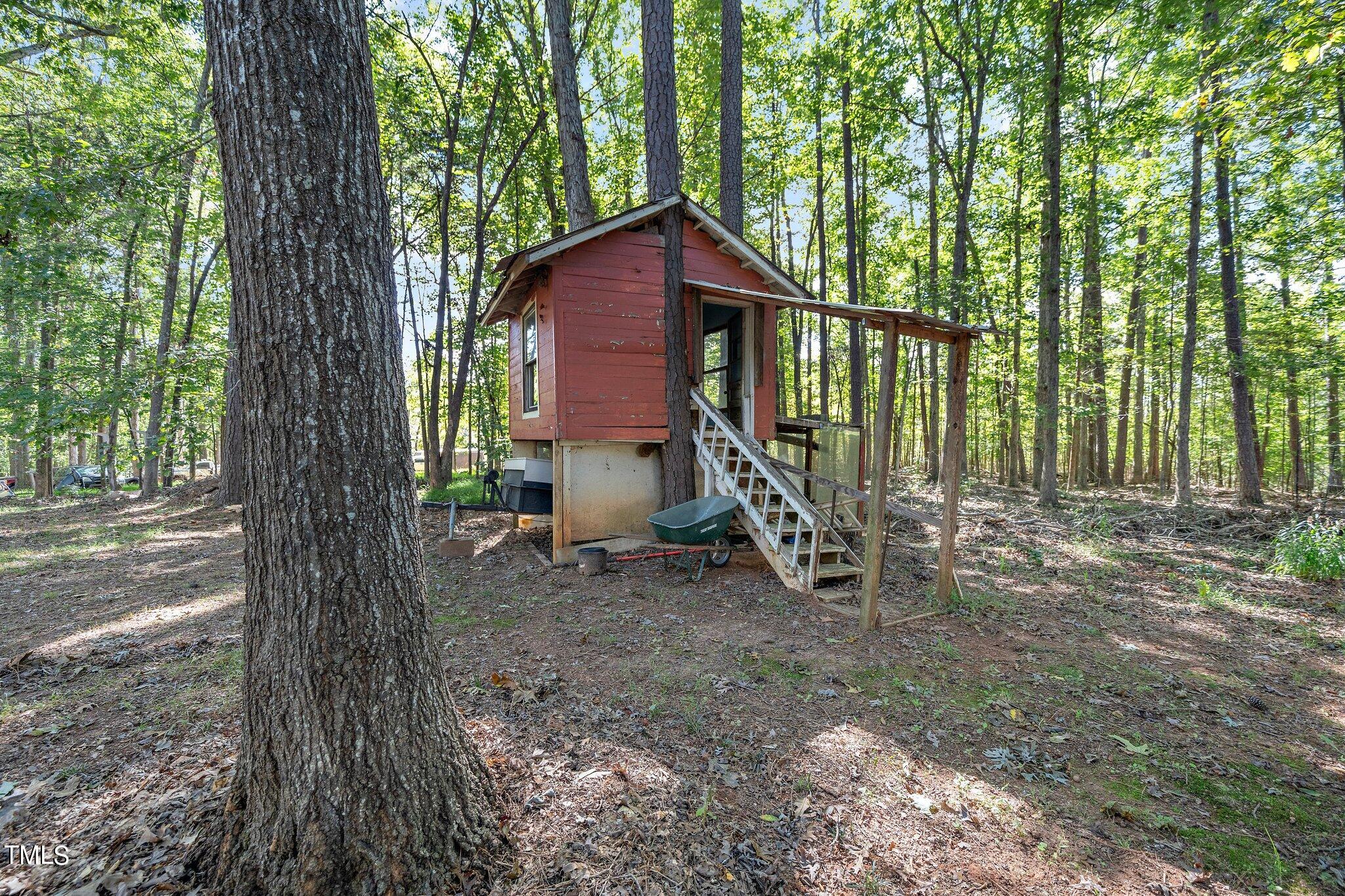 2514 Gemena Road Chapel Hill, NC 27516 - Photo 18 of 21 a view of a house with a yard and large trees