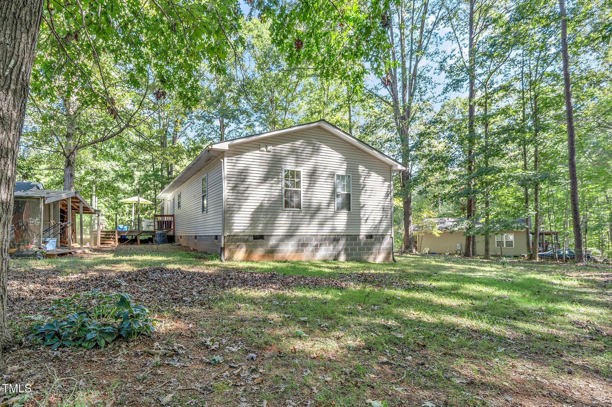 2514 Gemena Road Chapel Hill, NC 27516 - Photo 19 of 21 a backyard of a house with lots of green space