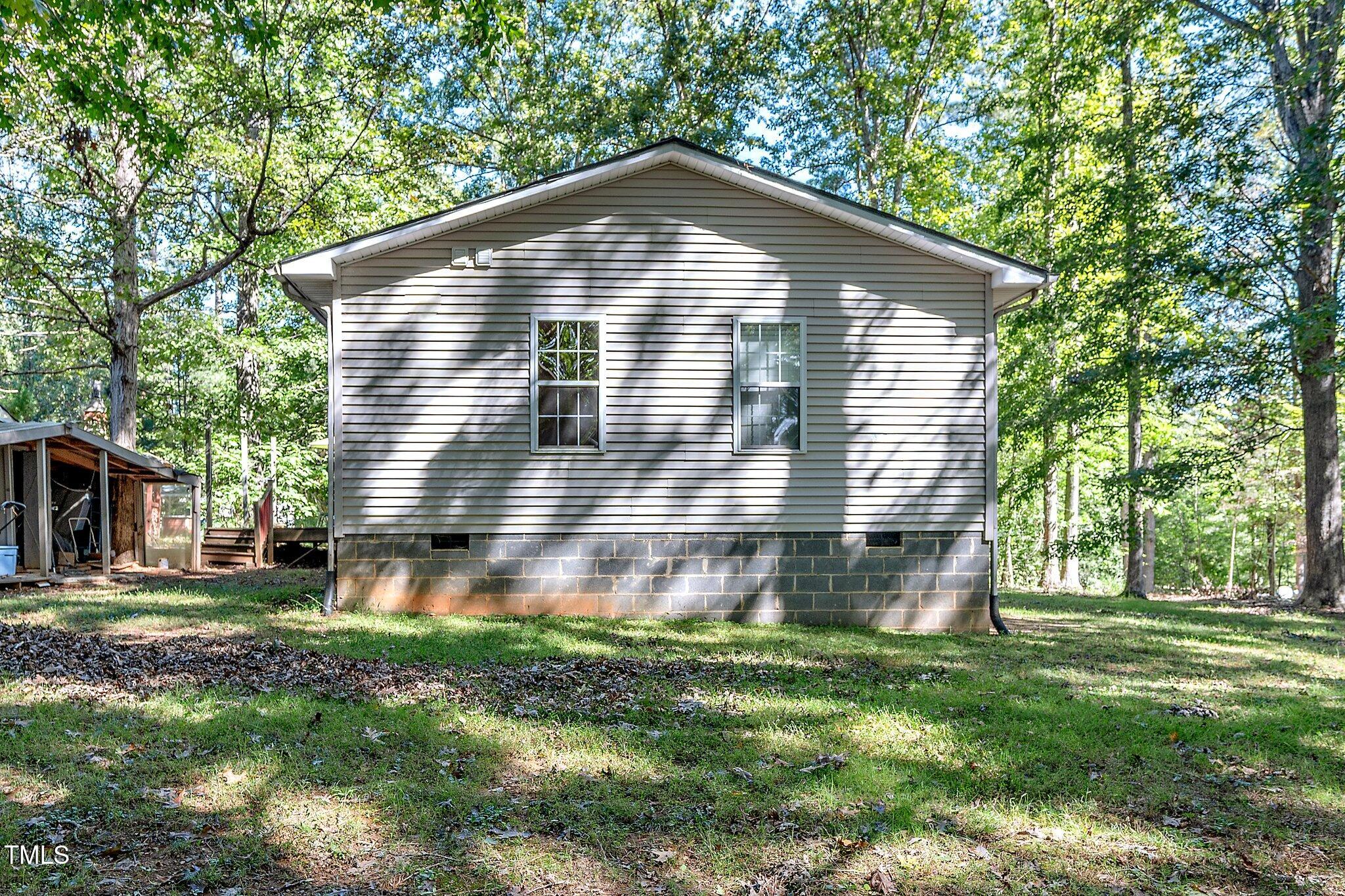 2514 Gemena Road Chapel Hill, NC 27516 - Photo 20 of 21 a front view of house with yard and green space