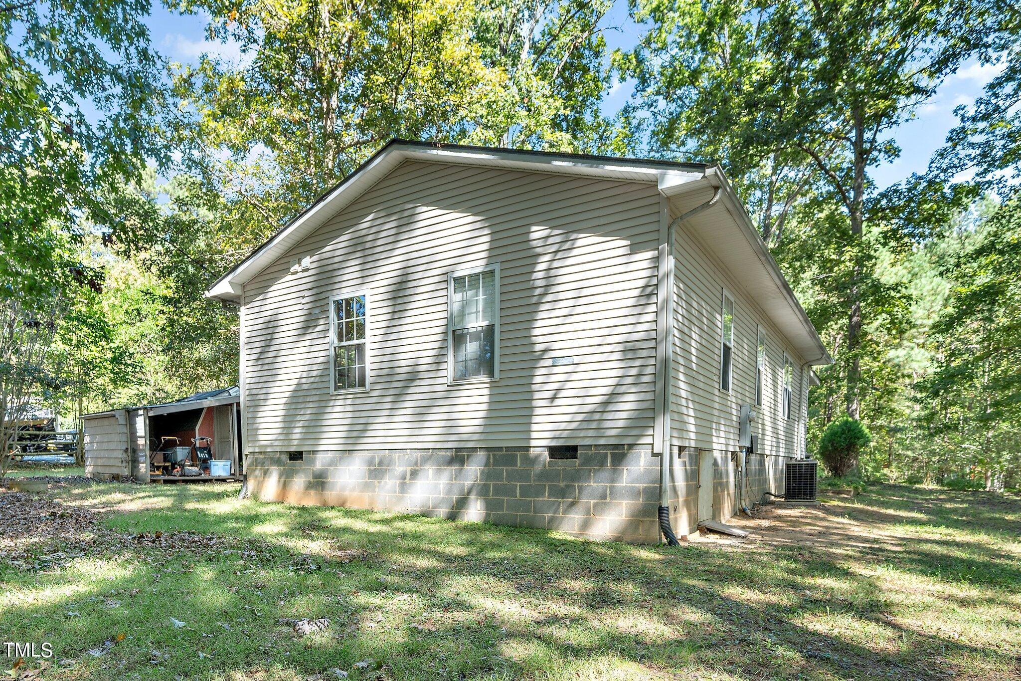 2514 Gemena Road Chapel Hill, NC 27516 - Photo 21 of 21 a backyard of a house with table and chairs