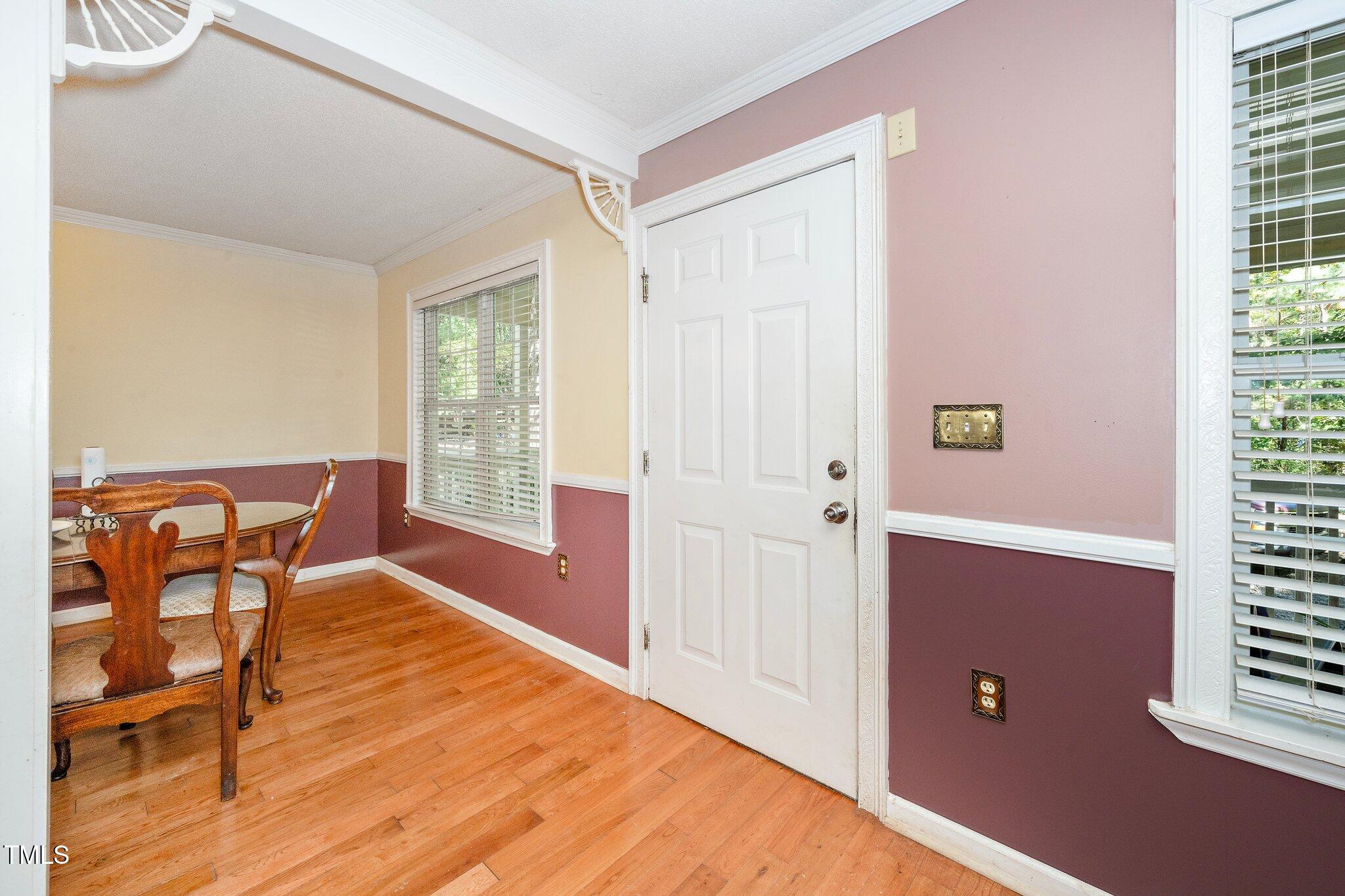 2514 Gemena Road Chapel Hill, NC 27516 - Photo 7 of 21 a view of a livingroom with dining area wooden floor and windows
