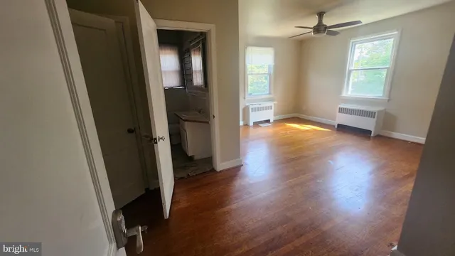 a kitchen with a sink a microwave and cabinets