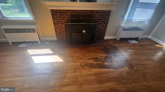 a view of a livingroom with furniture and stairs