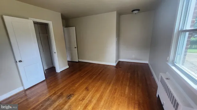 a view of walk in closet with empty tub