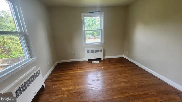 a bathroom with a sink toilet and window