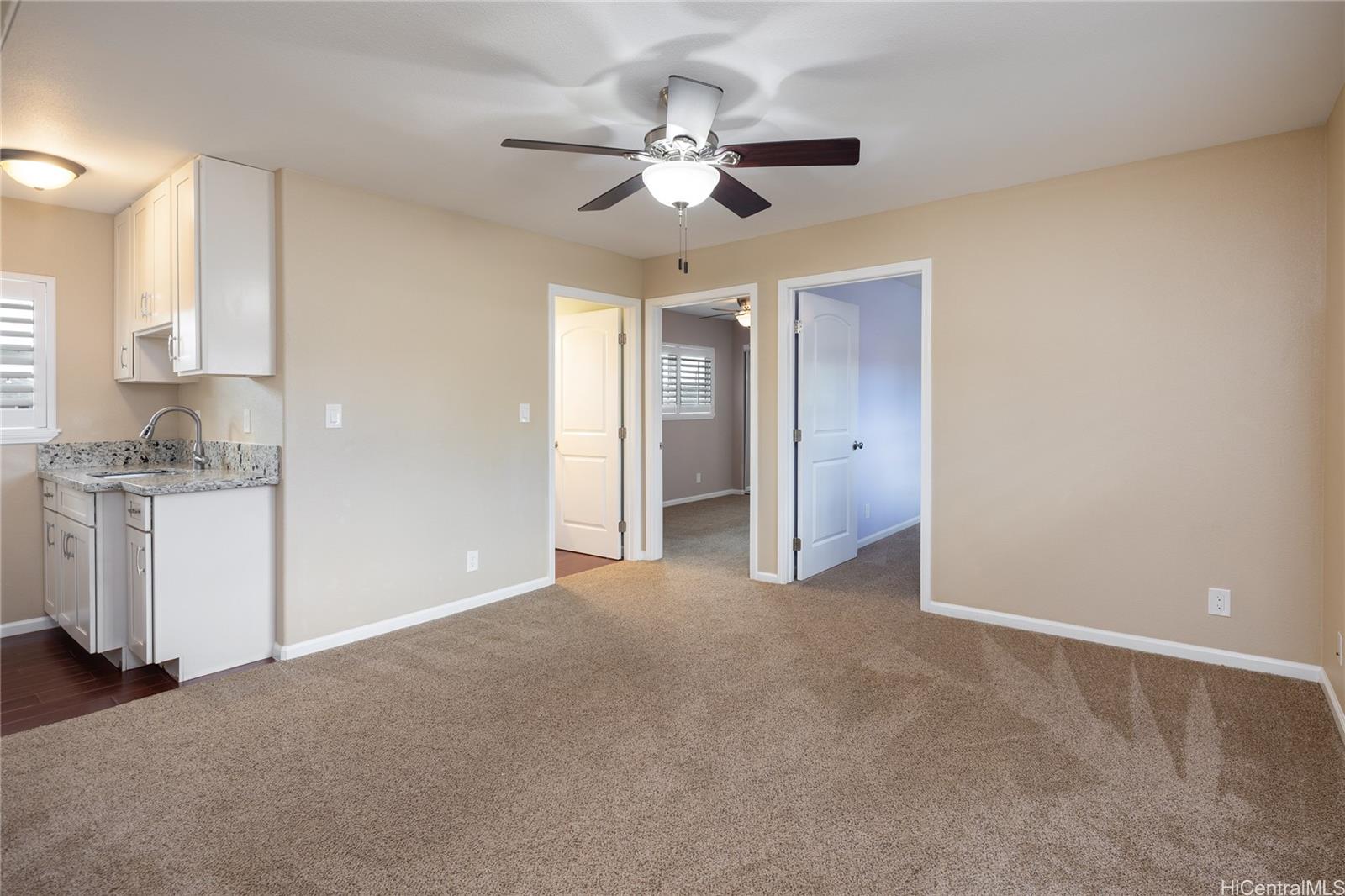 95-210 Kuauna Place Mililani, HI 96789 - Photo 18 of 25 a view of a kitchen with a sink and cabinet