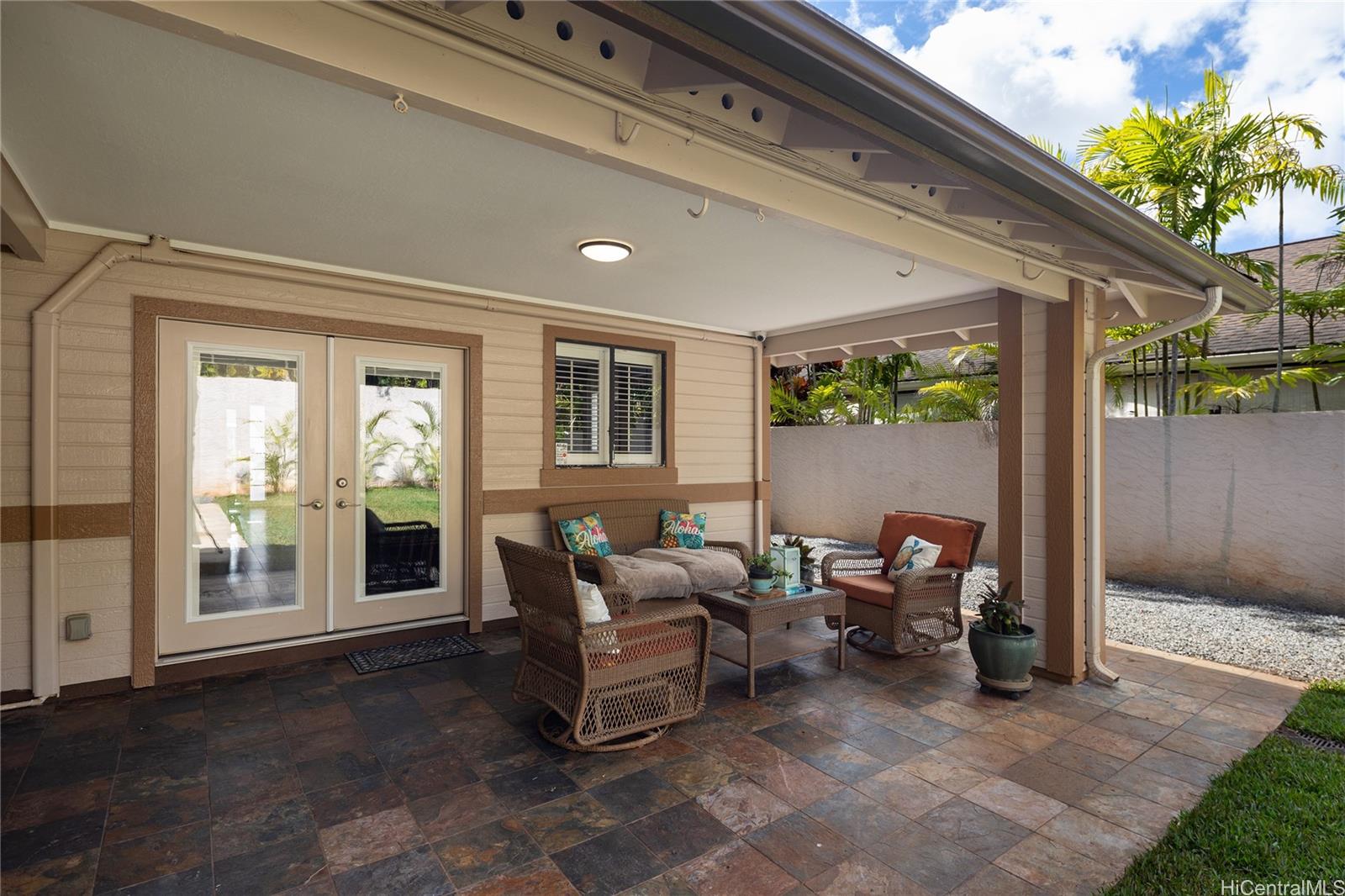 95-210 Kuauna Place Mililani, HI 96789 - Photo 22 of 25 a living room with furniture and a potted plant