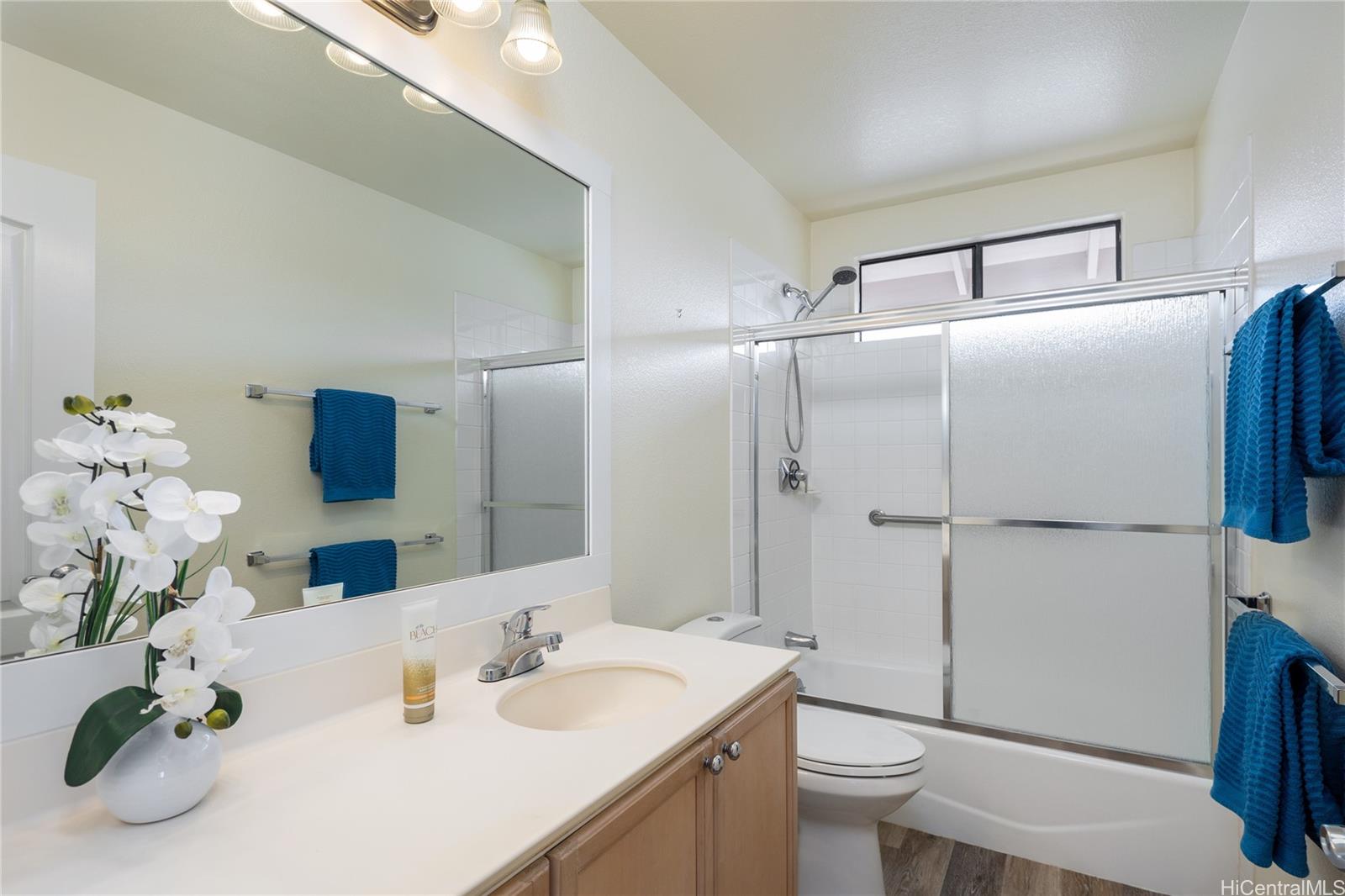 95-210 Kuauna Place Mililani, HI 96789 - Photo 10 of 25 a bathroom with a sink toilet and shower
