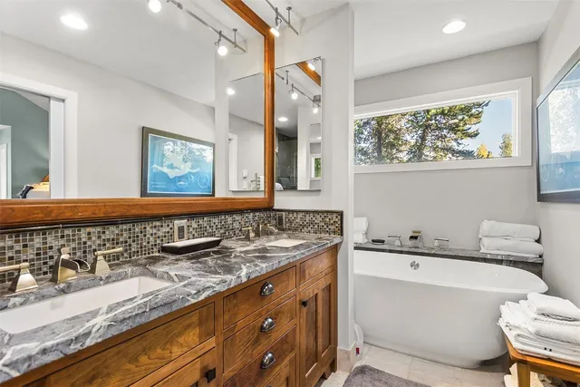 a bedroom with a bed and a large dresser