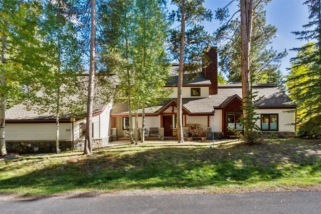 front view of a house with a tree