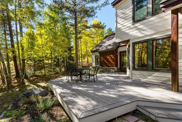 a view of a house with backyard porch and sitting area
