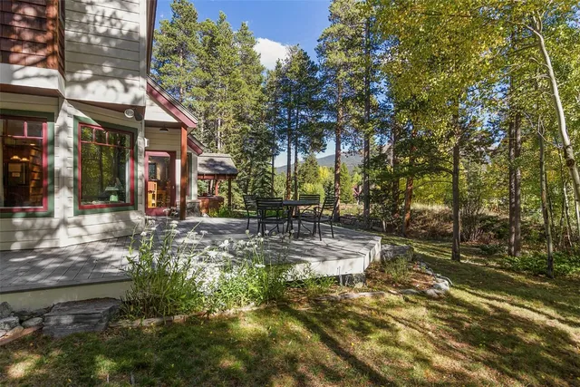 a view of a street with large trees