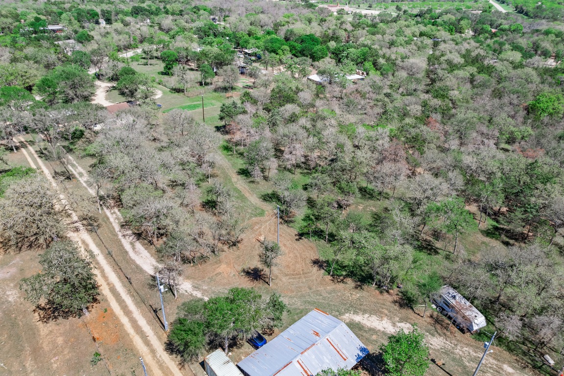 445 St Johns Road Dale, TX 78616 - Photo 17 of 17 an aerial view of a forest with houses
