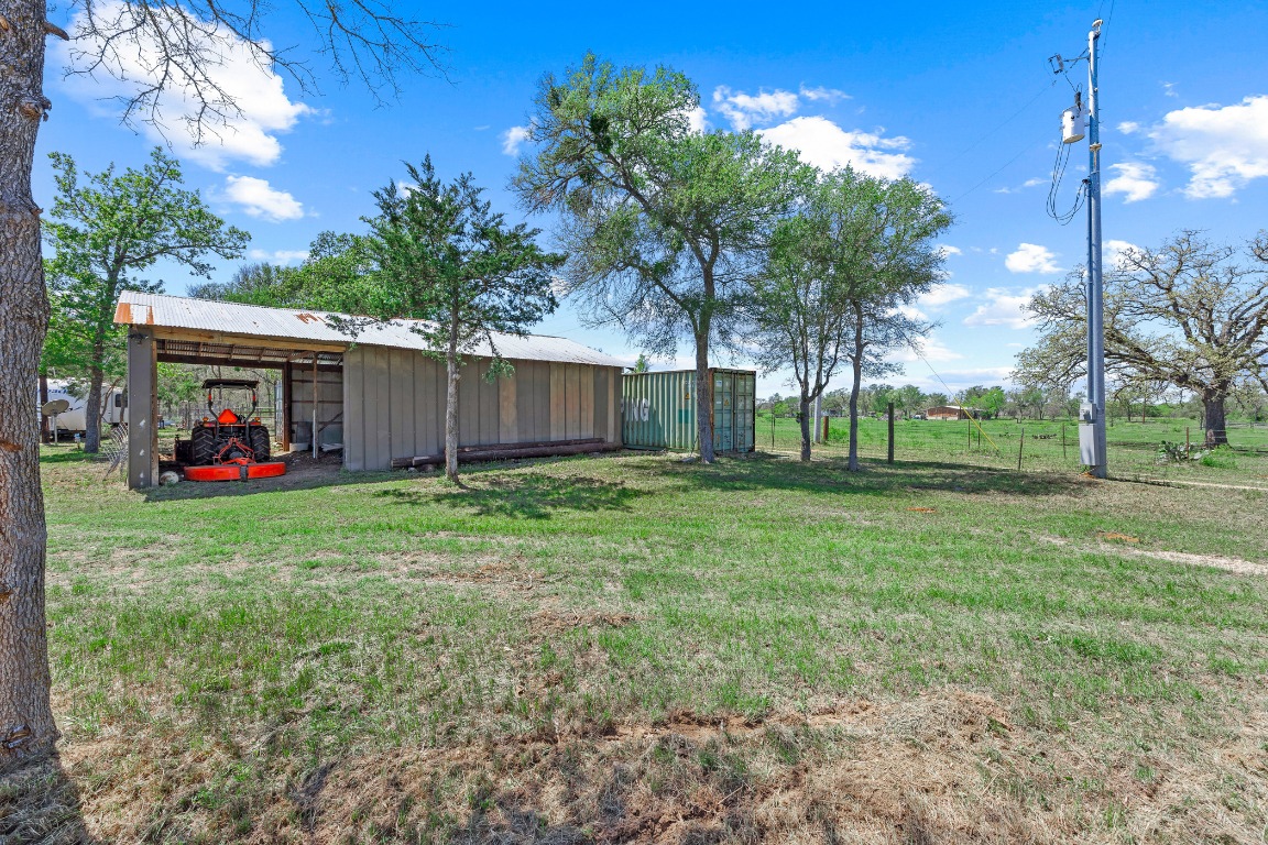 445 St Johns Road Dale, TX 78616 - Photo 6 of 17 a view of a house with backyard and a tree