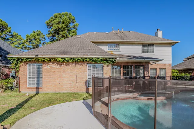 a front view of house with a garden