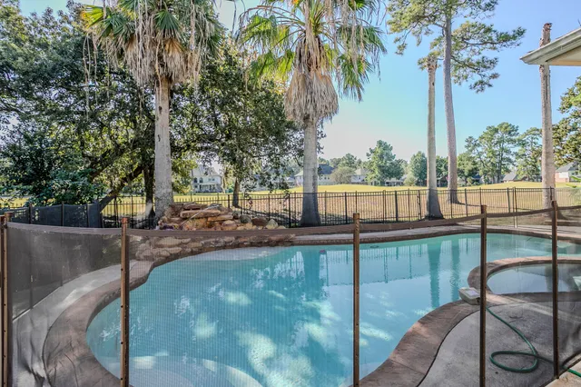 a view of a swimming pool with a patio