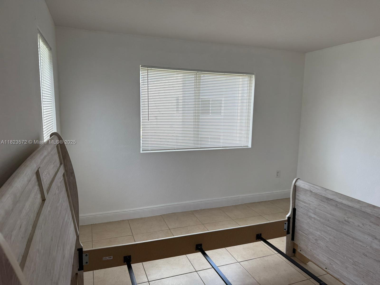 15422 Southwest 284th Street, Unit 7207 Homestead, FL 33033 - Photo 16 of 36 a room with a window and a wooden floor