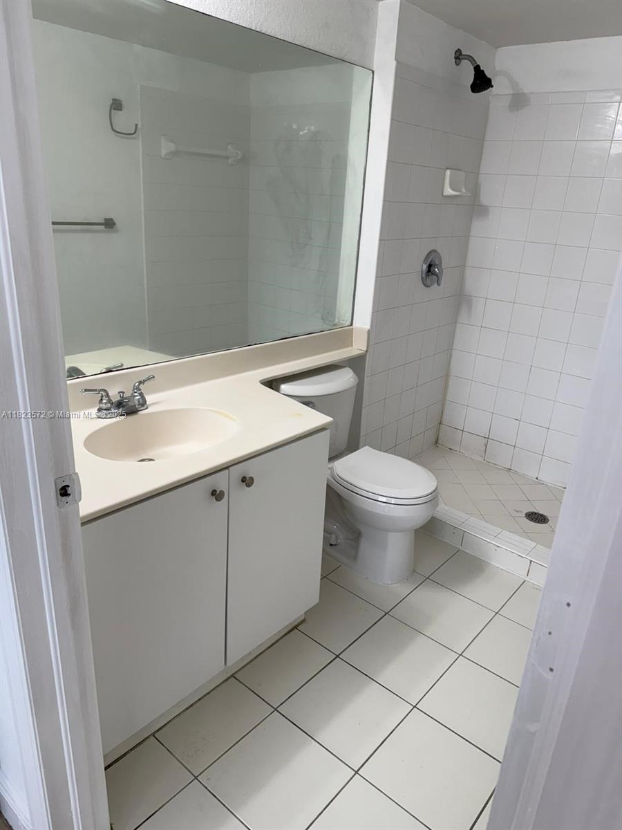 15422 Southwest 284th Street, Unit 7207 Homestead, FL 33033 - Photo 20 of 36 a bathroom with a sink toilet and shower