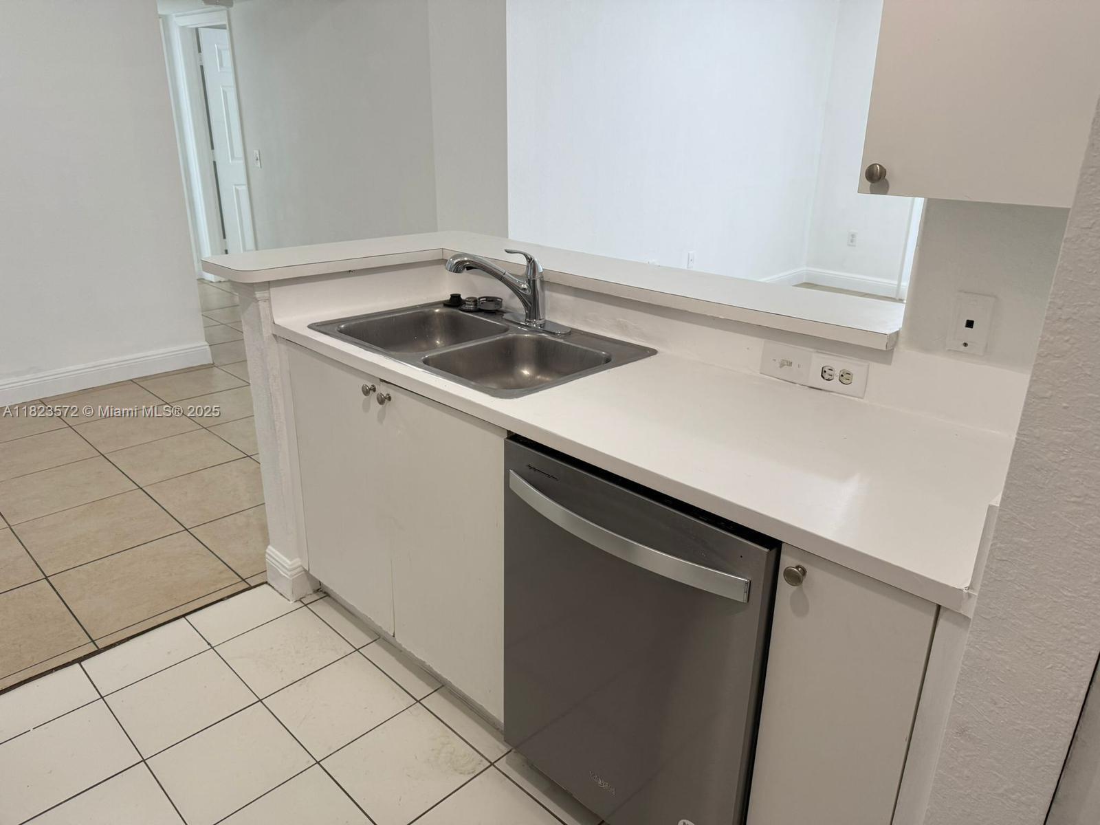 15422 Southwest 284th Street, Unit 7207 Homestead, FL 33033 - Photo 6 of 36 a kitchen with a sink and cabinets
