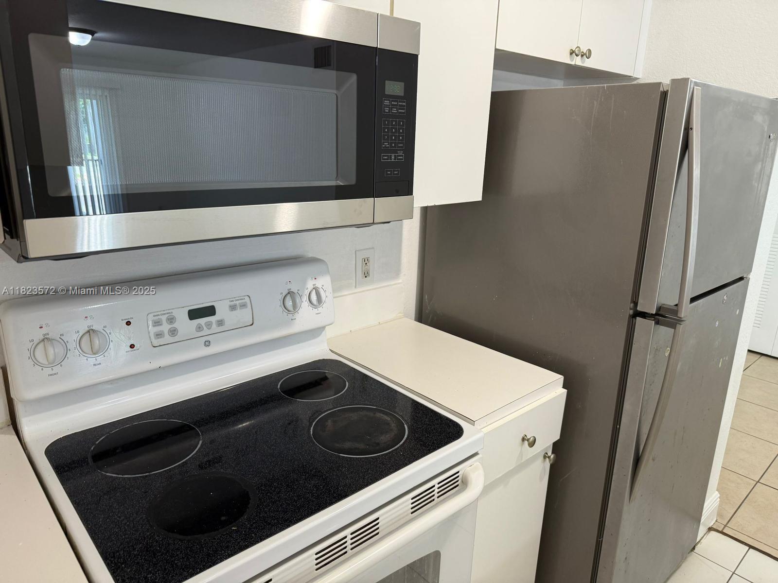 15422 Southwest 284th Street, Unit 7207 Homestead, FL 33033 - Photo 8 of 36 a utility room with dryer and washer
