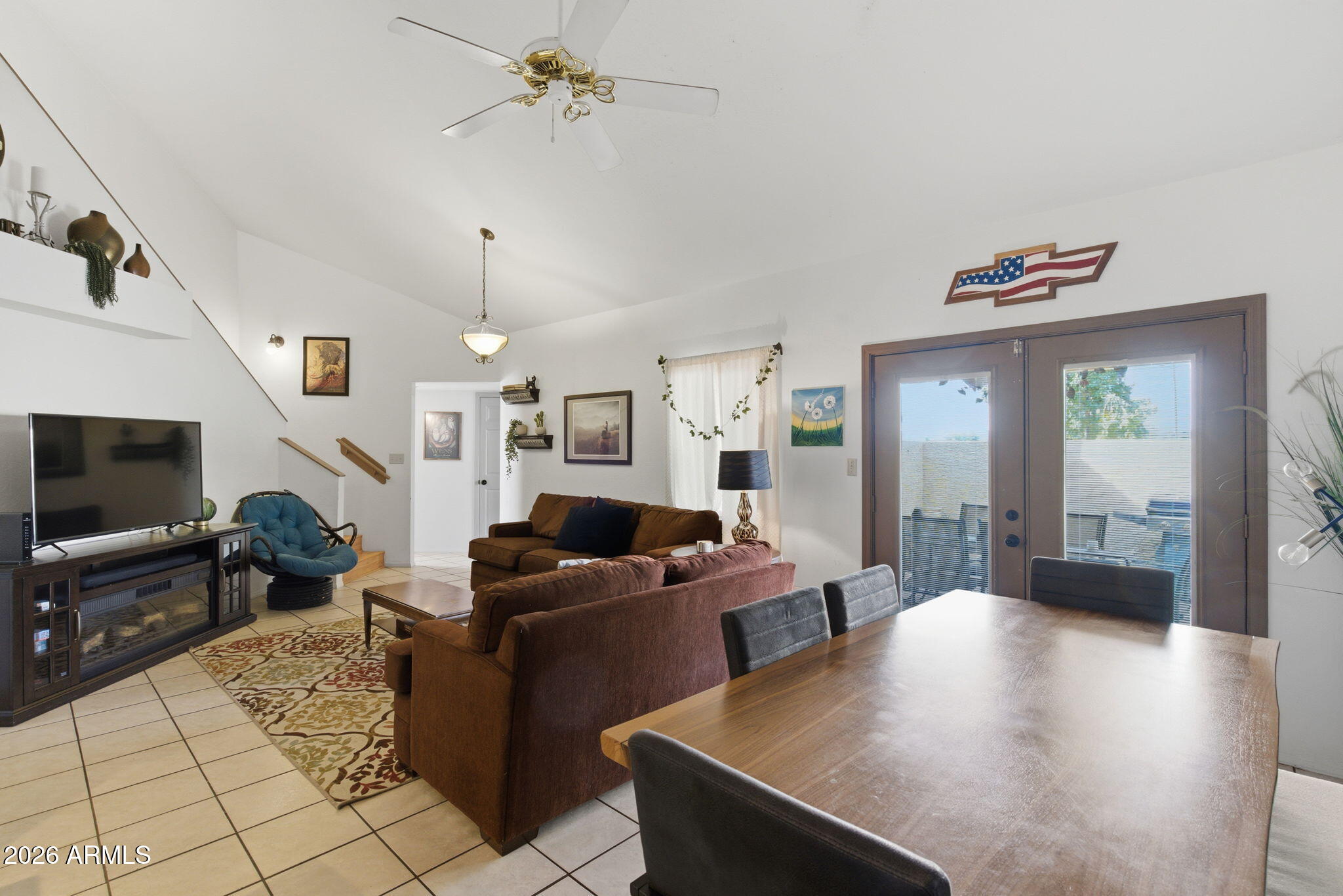 4218 West Boca Raton Road Phoenix, AZ 85053 - Photo 5 of 27 a living room with furniture and a flat screen tv