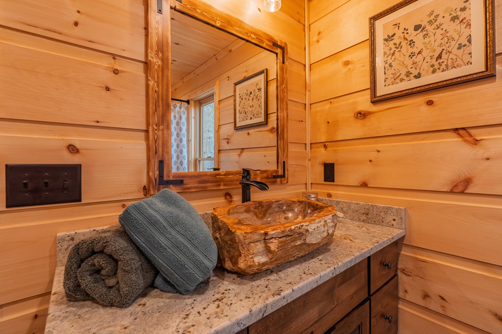 138 Rhondas Way Ellijay, GA 30540 - Photo 17 of 26 a bed sitting in a bedroom next to a window