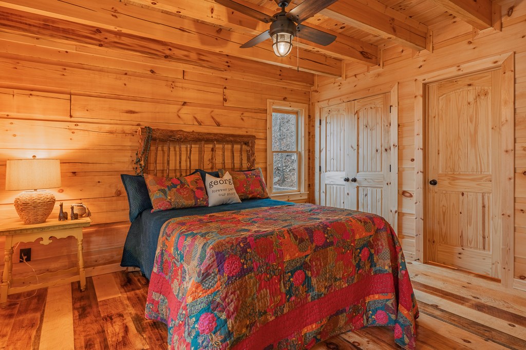 138 Rhondas Way Ellijay, GA 30540 - Photo 6 of 26 a bed sitting in a bedroom next to a shower