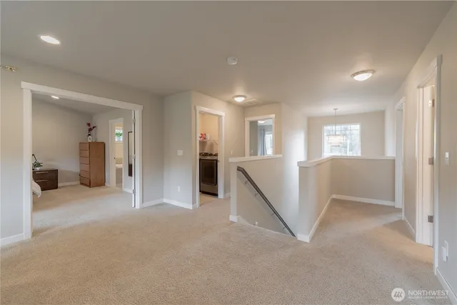 a view of a livingroom with furniture and windows