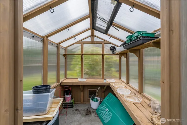 a view of a porch with furniture and a gate