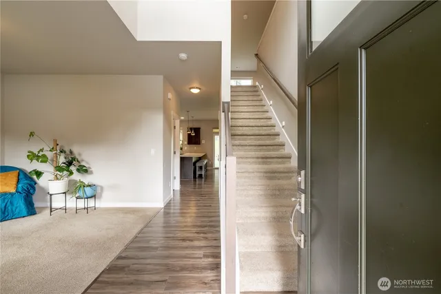 a lobby with furniture and rug
