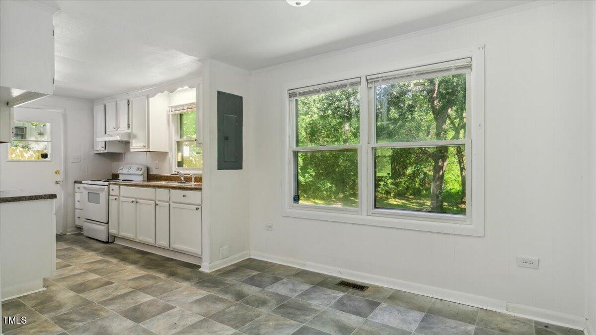 2530 Spring Valley Road Henderson, NC 27537 - Photo 11 of 45 a kitchen with sink cabinets and appliances
