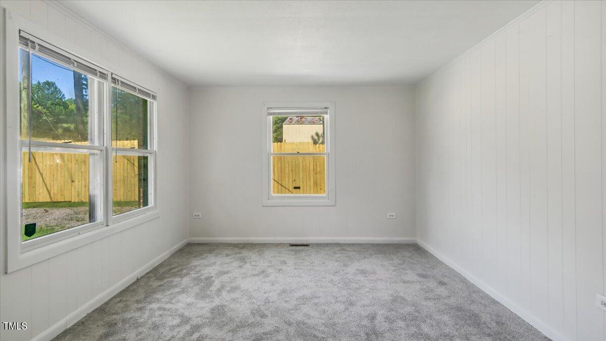 2530 Spring Valley Road Henderson, NC 27537 - Photo 14 of 45 an empty room with windows
