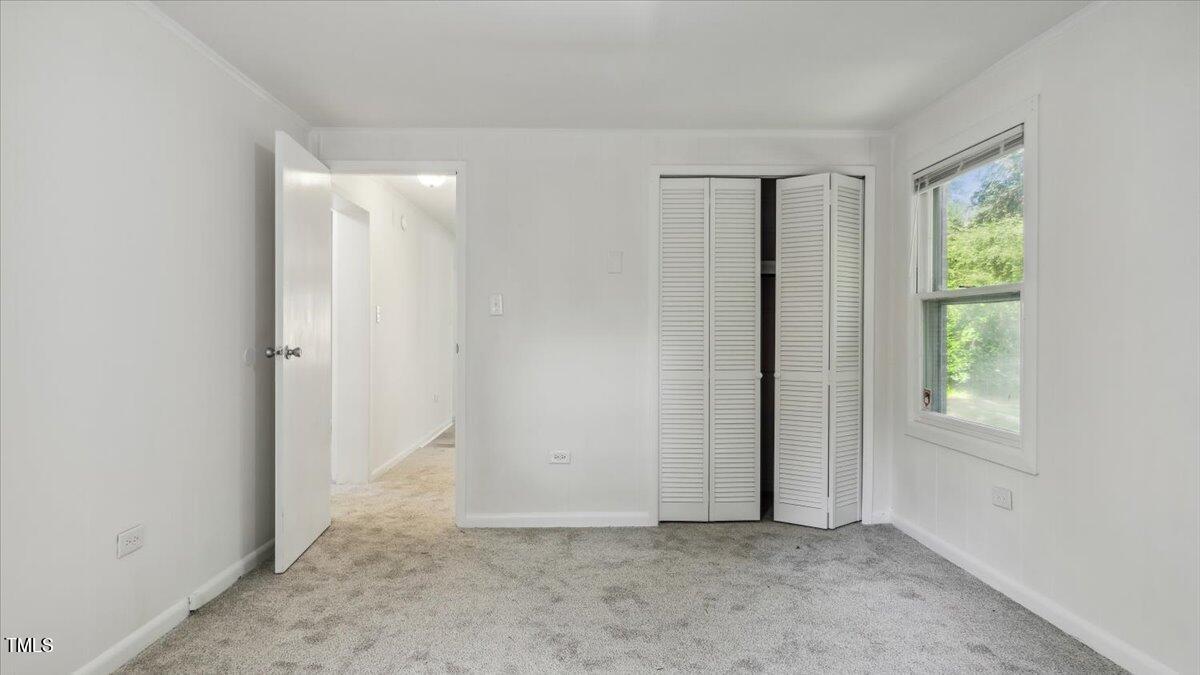 2530 Spring Valley Road Henderson, NC 27537 - Photo 17 of 45 an empty room with windows and closet