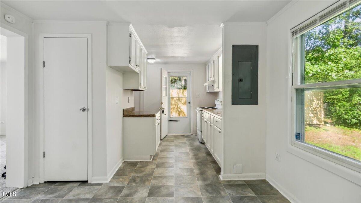 2530 Spring Valley Road Henderson, NC 27537 - Photo 2 of 45 a view of a kitchen with a refrigerator and a window