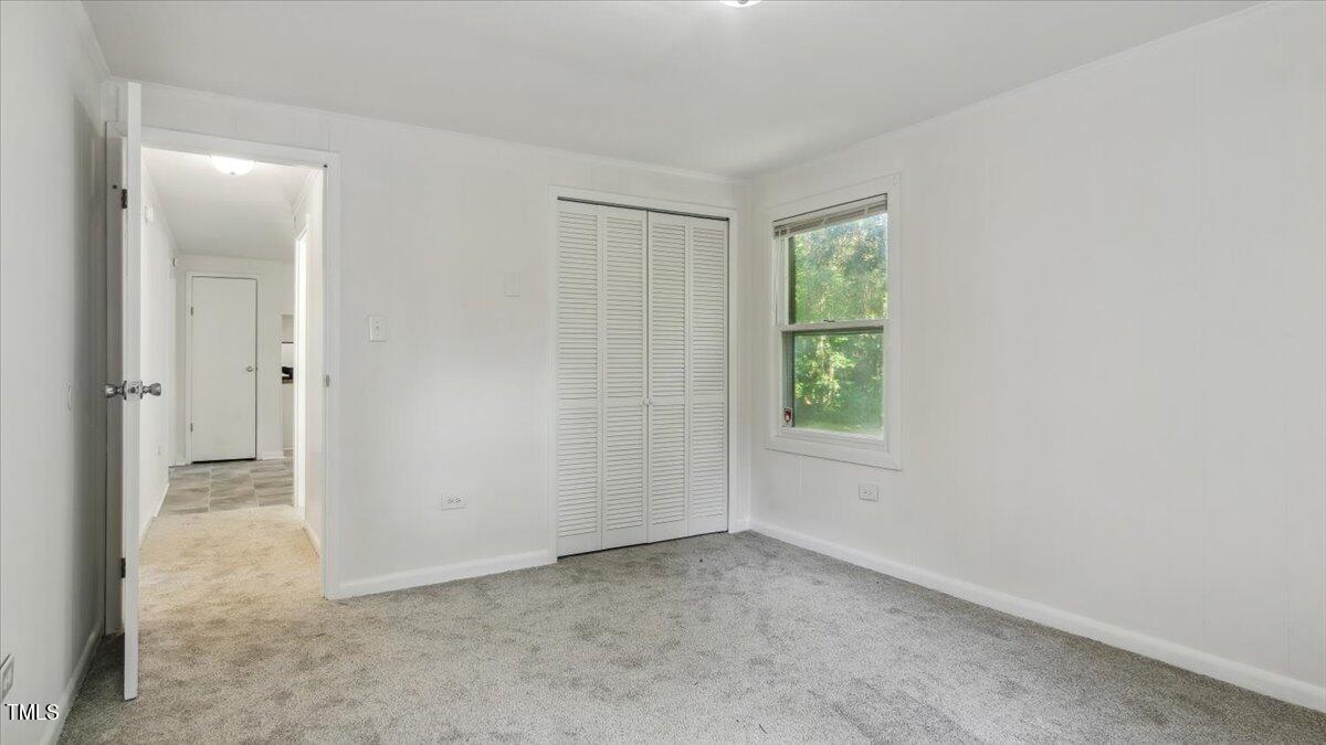2530 Spring Valley Road Henderson, NC 27537 - Photo 21 of 45 an empty room with windows