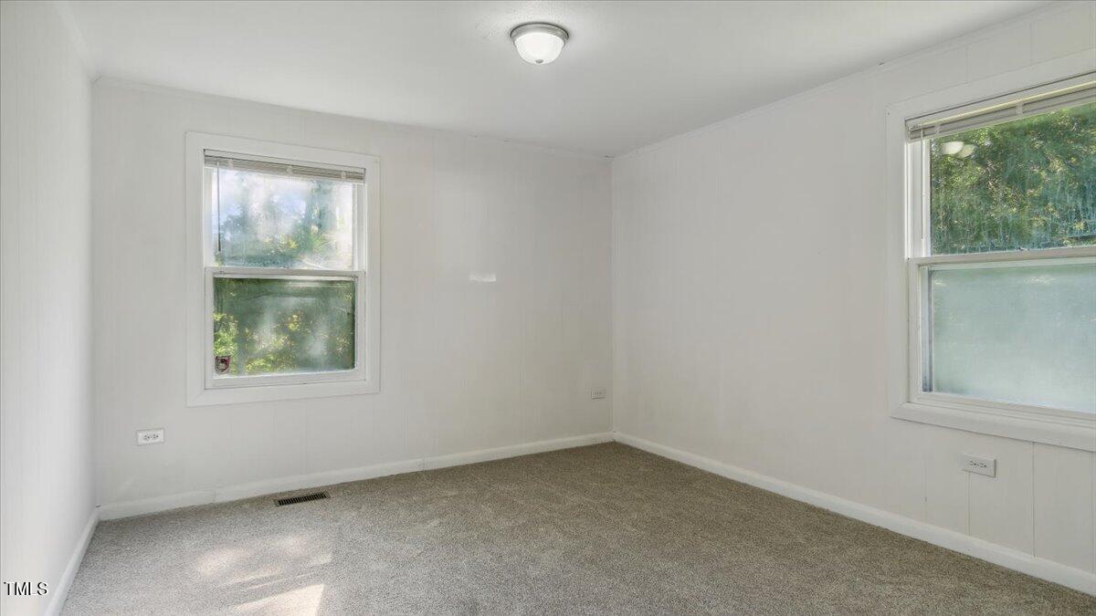 2530 Spring Valley Road Henderson, NC 27537 - Photo 22 of 45 an empty room with windows