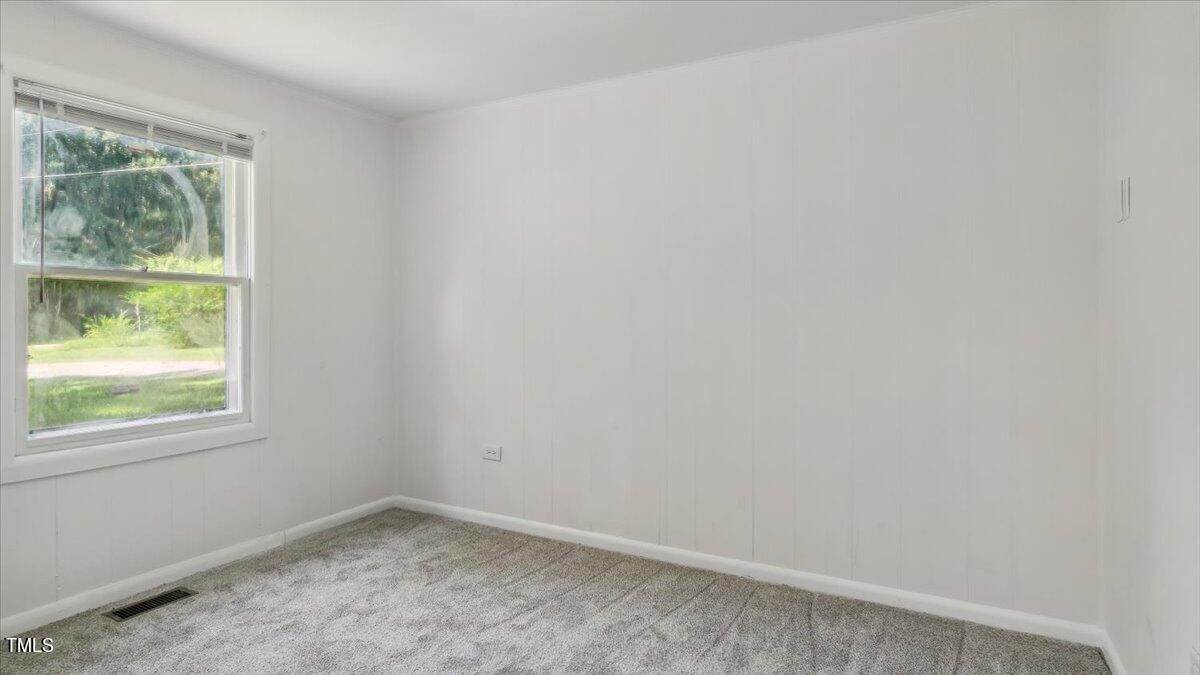 2530 Spring Valley Road Henderson, NC 27537 - Photo 27 of 45 an empty room with a window