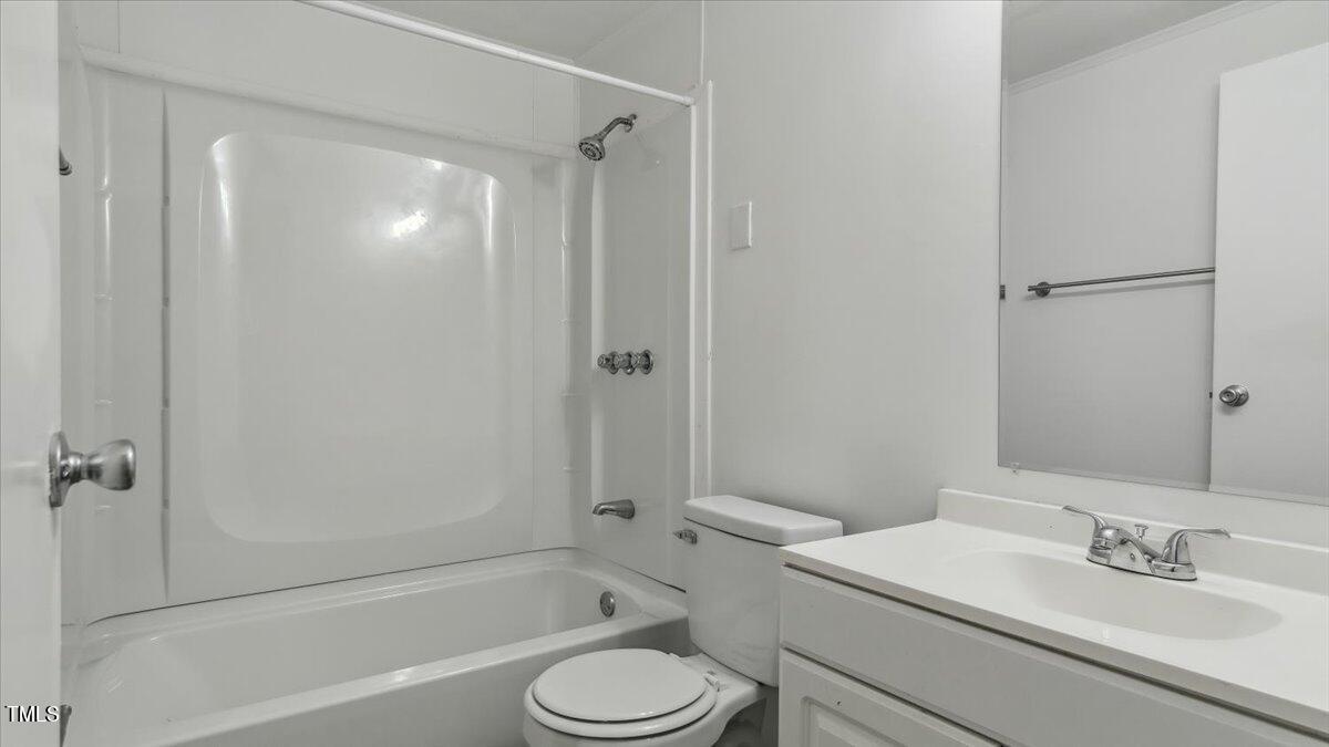 2530 Spring Valley Road Henderson, NC 27537 - Photo 33 of 45 a bathroom with a sink toilet and shower