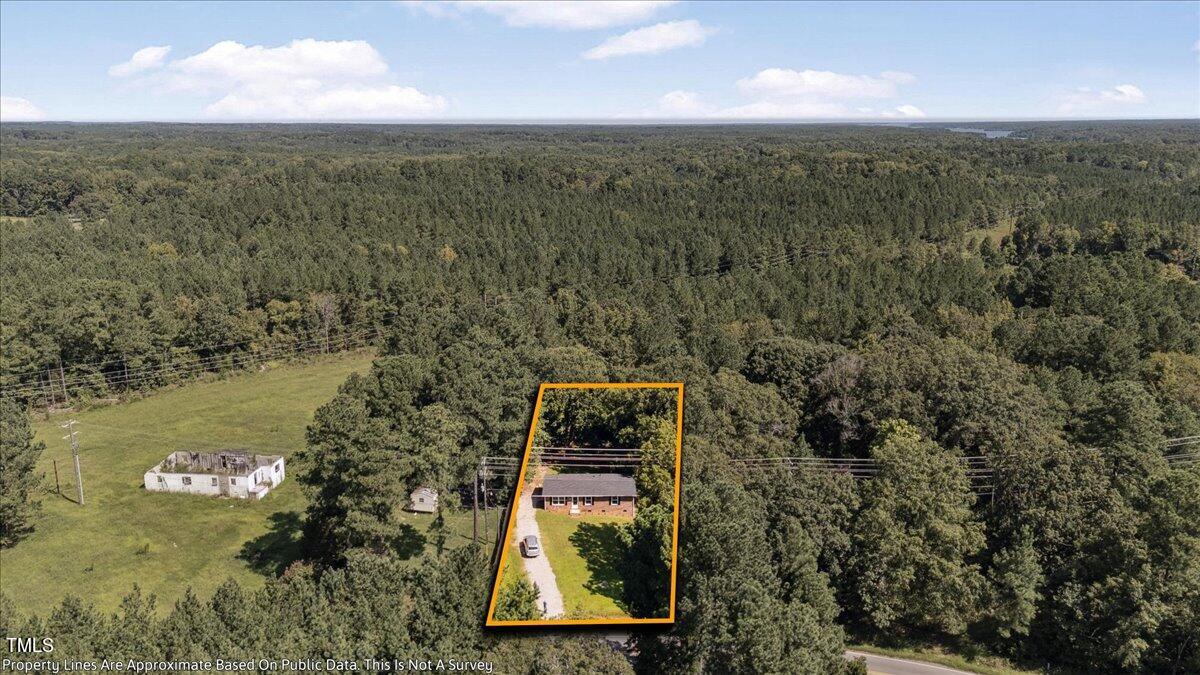 2530 Spring Valley Road Henderson, NC 27537 - Photo 35 of 45 an aerial view of a house with a yard