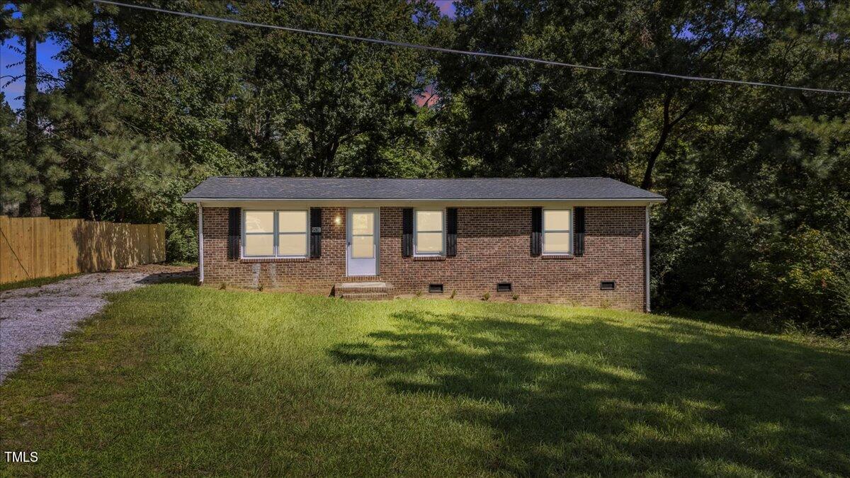 2530 Spring Valley Road Henderson, NC 27537 - Photo 45 of 45 a view of a house with backyard and garden