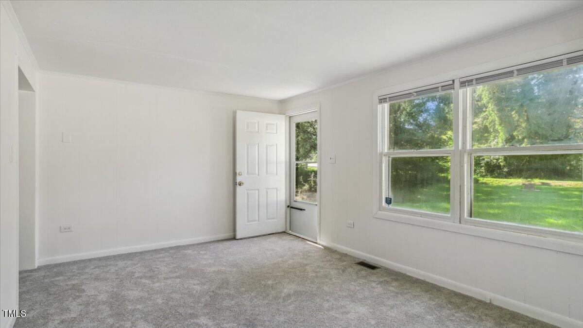 2530 Spring Valley Road Henderson, NC 27537 - Photo 5 of 45 an empty room with windows and closet