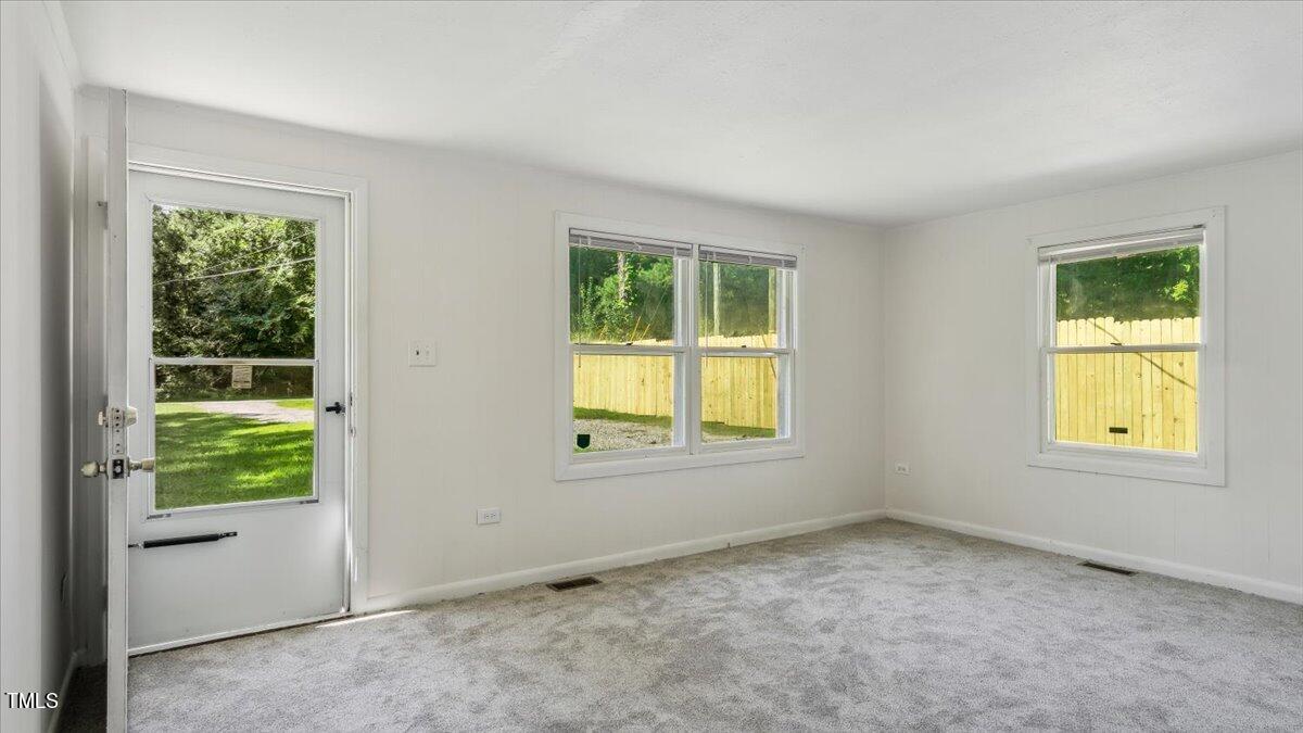 2530 Spring Valley Road Henderson, NC 27537 - Photo 6 of 45 a view of an empty room with a window