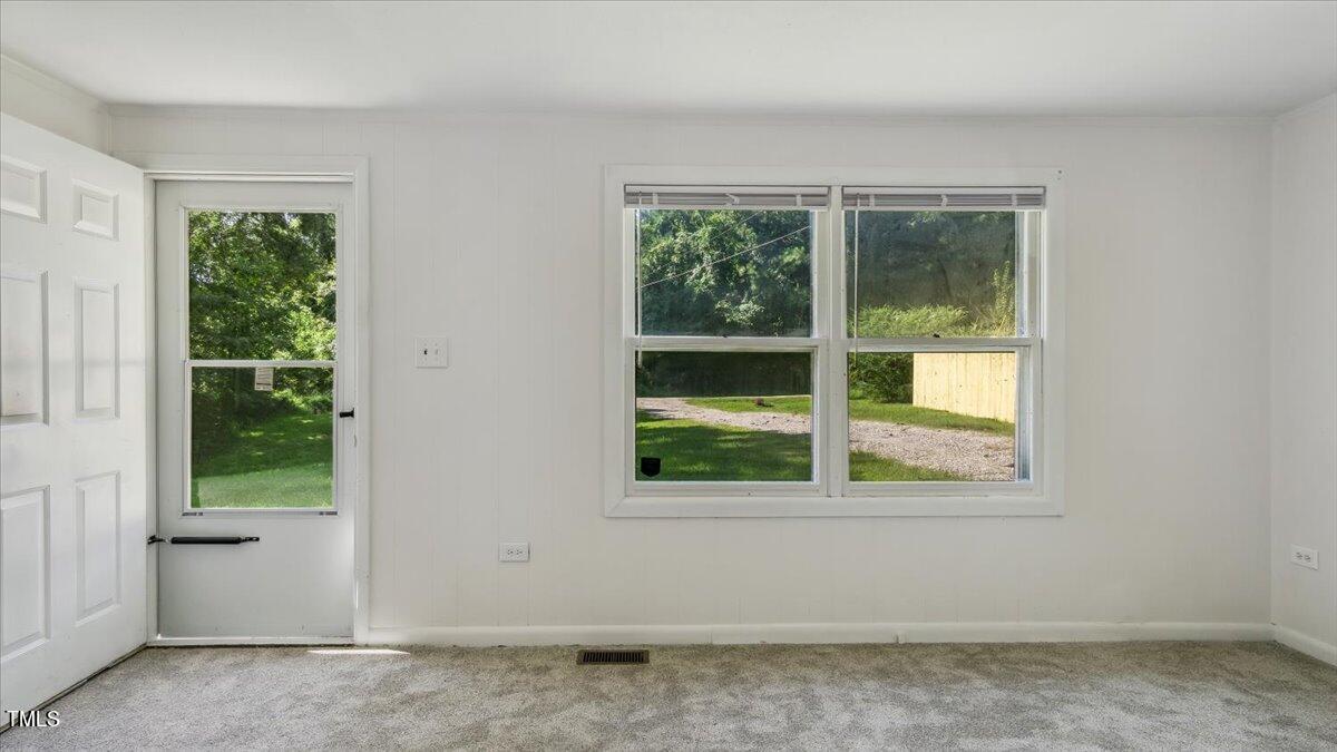 2530 Spring Valley Road Henderson, NC 27537 - Photo 7 of 45 a view of a room that has a window in it