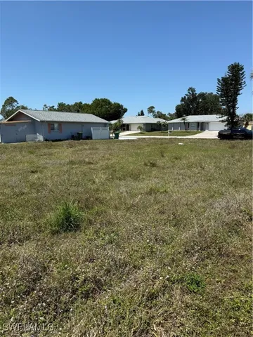 a view of a large body of water with a building in the background