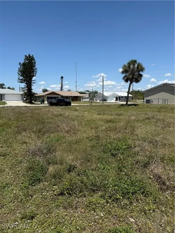 a view of a field with an trees