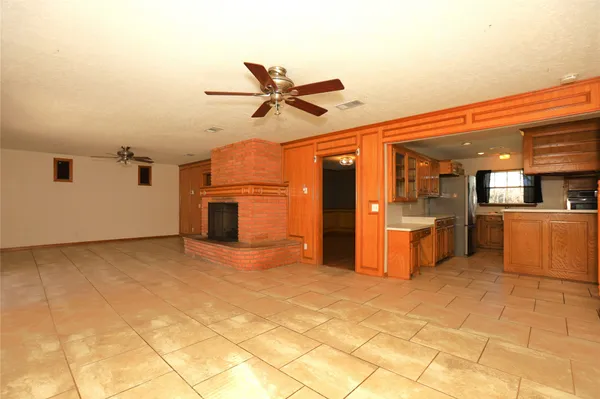 a view of a kitchen with a sink and cabinets