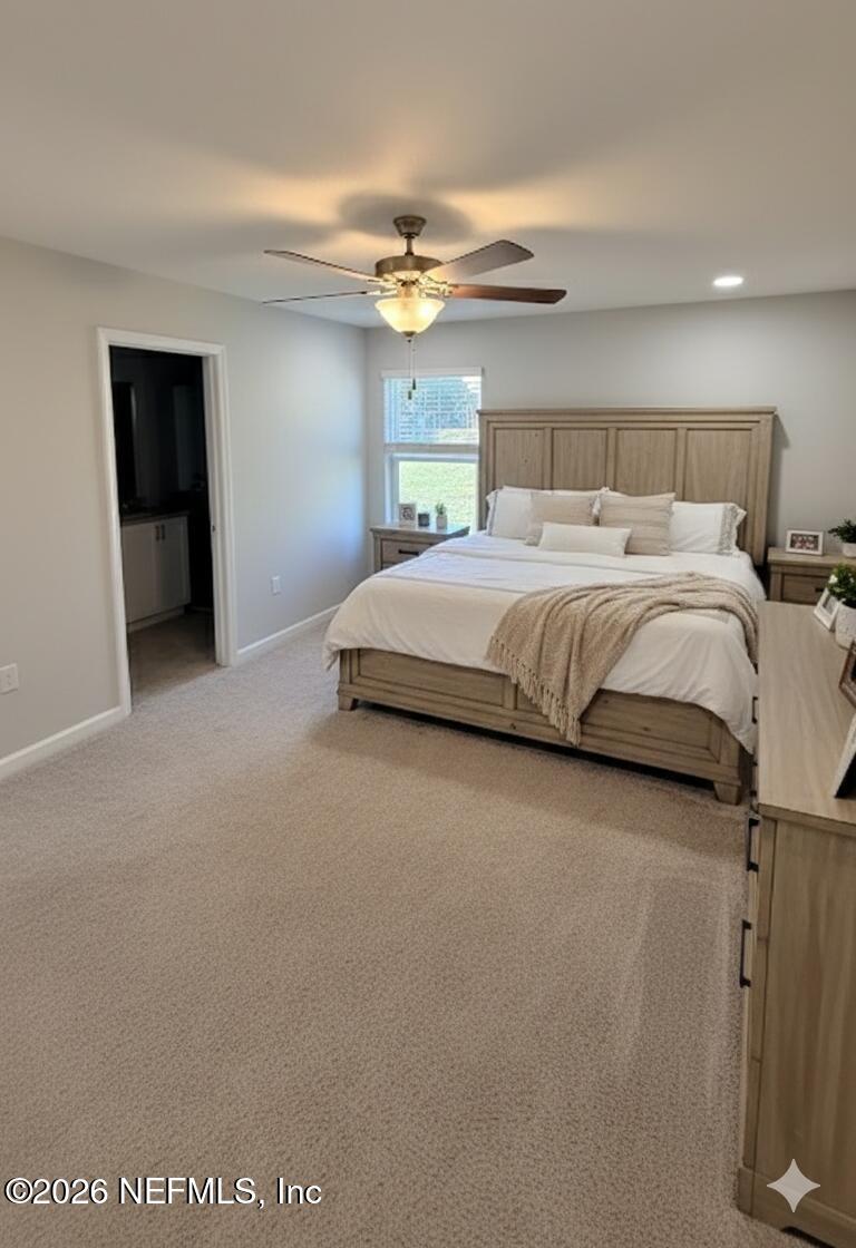 1082 Cahoon Road South Jacksonville, FL 32221 - Photo 8 of 9 a bedroom with a bed and a window