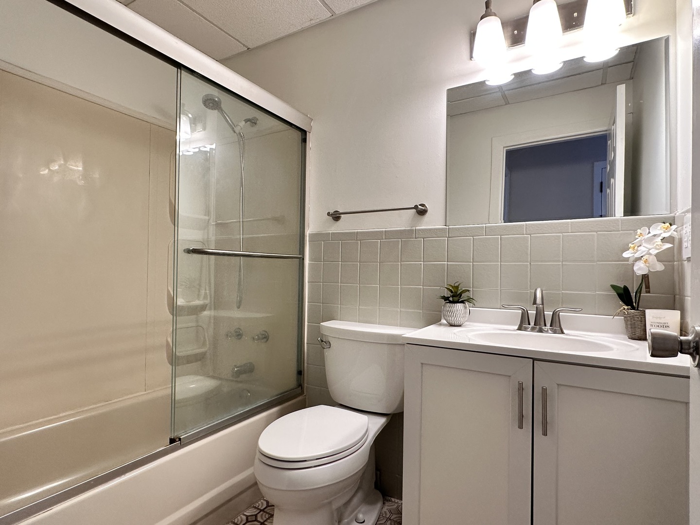 10357 Dearlove Road, Unit 1K Glenview, IL 60025 - Photo 18 of 24 a bathroom with a sink toilet and shower