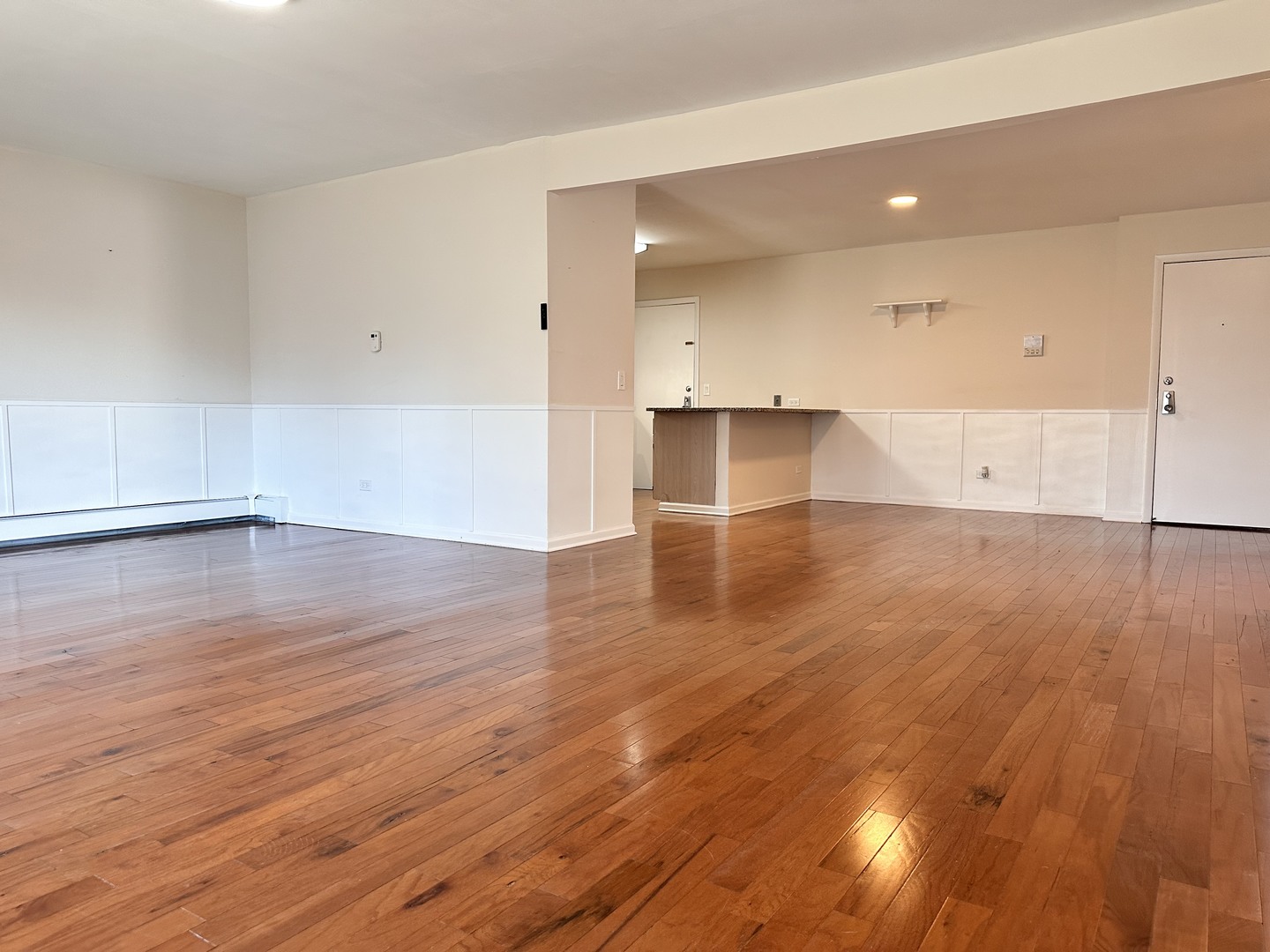 10357 Dearlove Road, Unit 1K Glenview, IL 60025 - Photo 4 of 24 an empty room with wooden floor