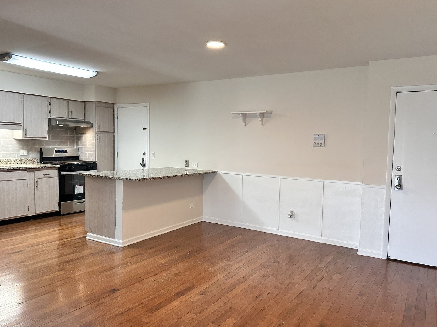 10357 Dearlove Road, Unit 1K Glenview, IL 60025 - Photo 8 of 24 a view of kitchen with wooden cabinet